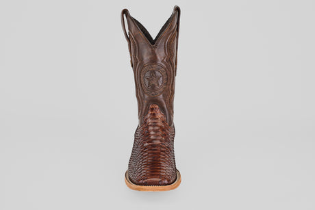 The Tanner - Brown - Square Toe cowboy boot features a star emblem and textured pattern, model 501-N, displayed from the front against a plain light gray background.