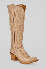 The Allison Cream - Tall Shaft - Snip Toe boot features a tall, tan design with decorative stitching, a pointed snip toe, and a chunky wooden heel, displayed against a plain light background.