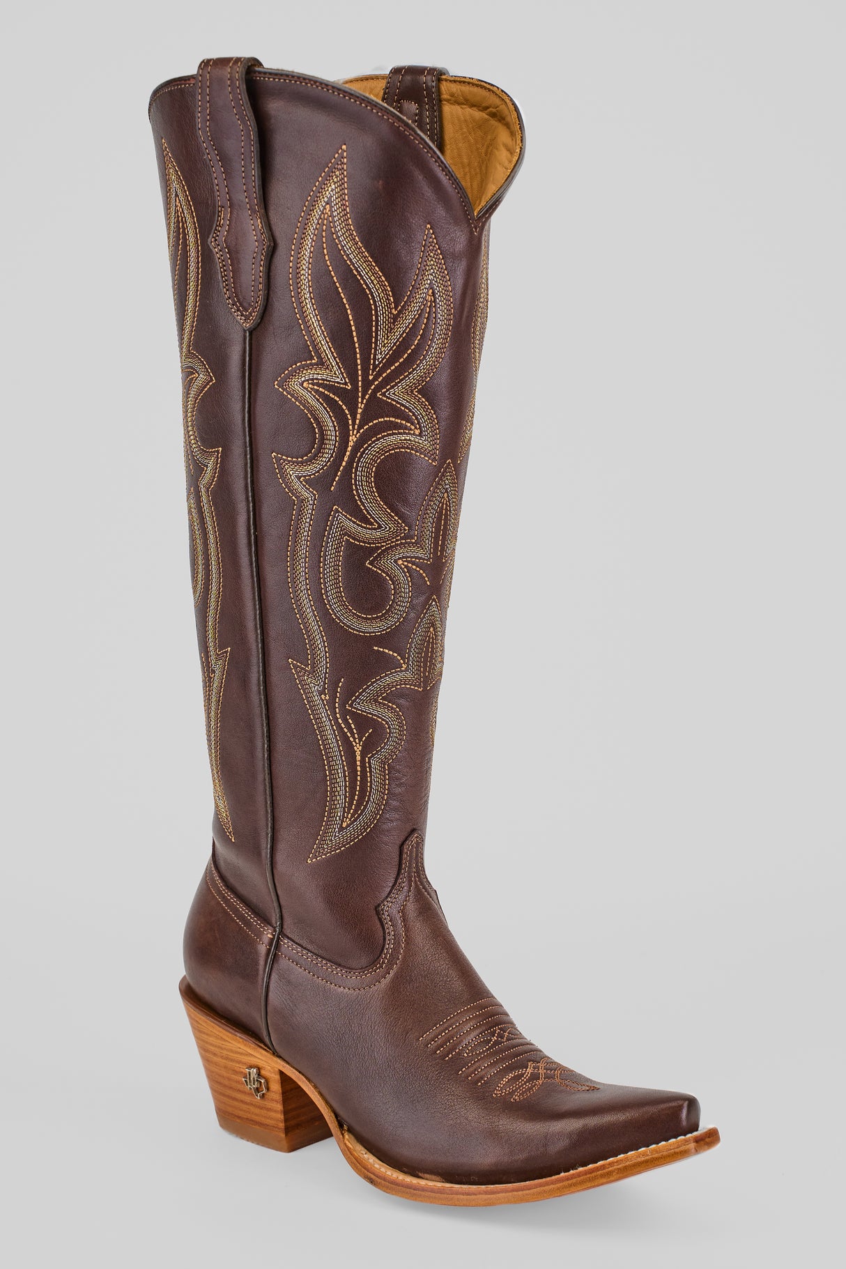 The Allison Dark Moka - Tall Shaft - Snip Toe cowboy boot features dark mocha leather, decorative light stitching, a pointed toe, and a wooden angled heel, shown against a plain light gray background.