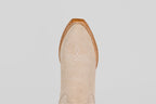 A top-down view of the Allison Ivory - Tall Shaft - Snip Toe boot highlights its ivory color, snip toe, white decorative stitching, and brown leather trim, exemplifying classic women's western boot style.