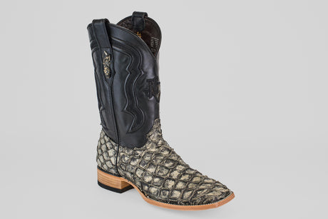 The Conor - Rustic Bone - Square Toe men’s cowboy boot features a black leather upper, a textured rustic bone fish leather lower, a wooden heel, and decorative stitching.