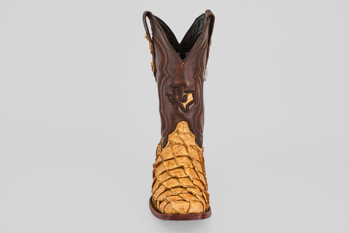 The Conor - Buttercup - Rodeo Toe boot features brown leather uppers and tan, textured reptile skin on the lower part, displayed from the front against a plain gray background.
