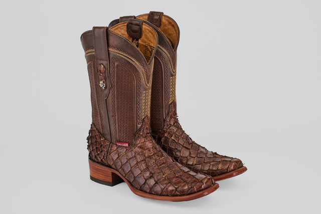 The Conor - Brown - Narrow Square Toe boots feature textured fish leather with decorative stitching, a mid-calf height, stacked wooden heels, and a narrow square toe, shown on a plain light gray background.