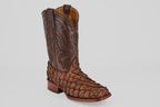 The Conor - Brown - Rodeo Toe boot features brown pirarucu leather with scale-like texture, decorative stitching on the shaft, a square rodeo toe, and a wooden heel, showcased against a light gray background.