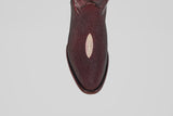 The Ranger – Wine – Round Toe, a single burgundy leather shoe featuring a unique oval light patch on the upper, reminiscent of stingray leather boots, is shown from above against a plain light gray background.