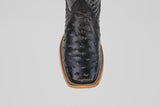 A close-up top view of the Ostrich Black - Embossed Leather - Square Toe (E424) boots with a light brown stitched sole, displayed on a plain gray background.