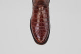 A close-up top view of the James Platimun - Dark Cogñac - Roper Toe (Diamond), featuring brown crocodile-patterned leather styled like men's western boots, set against a plain light background.