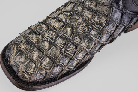 Close-up of the Conor Platinum - Newspaper - Square Toe (Diamond), a men's western boot with textured, croc-embossed material and visible stitching for a distinctive cowboy style.