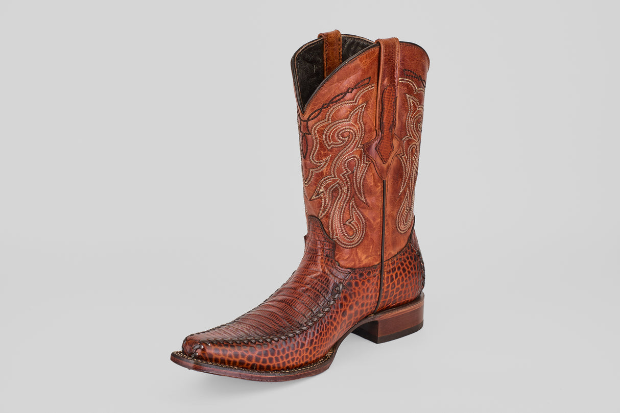 A single Lizard Cogñac - Embossed Leather - Versy Toe (E201) boot with detailed stitching and patterned leather is shown on a light gray background.