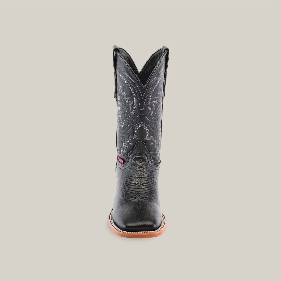 A Barcelona Black Square Toe cowboy boot handcrafted from premium cowhide stands upright against a plain white background, featuring intricate stitching, a red side detail, and a brown sole.