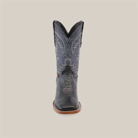 The Lizard Print Black - Square Toe cowboy boot, crafted from premium cowhide, features intricate stitching and a leather sole with brown accents. It showcases its elegant design on a plain white background.