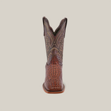 Front view of the Caiman Hornback Print Chocolate - Square Toe, a brown, artisan-made cowboy boot. It boasts intricate stitching, textured leather, a distinctive square toe, and a slightly curved top against a plain white background.