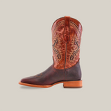 A single Azkar Moka - Square Toe cowboy boot stands against a white background. Crafted from rich cowhide leather, it features intricate stitching, a wooden heel, and a slightly pointed toe for classic charm, complemented by a pull strap at the top.