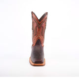 A top view of Azkar Moka boots reveals intricate stitching on the dark cowhide leather toe and an ornate design on the shaft. These boots, crafted from premium materials, feature a light brown slip-resistant sole with a visible seam around the edge.