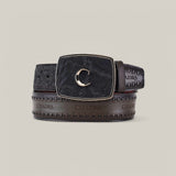 The Black Elephant Laser & Woven Belt - BC313 showcases a stylish black leather finish, featuring a large rectangular hebilla única with a decorative gold letter C. It boasts detailed stitching and patterns, along with the Cuadra brand name embossed repeatedly.