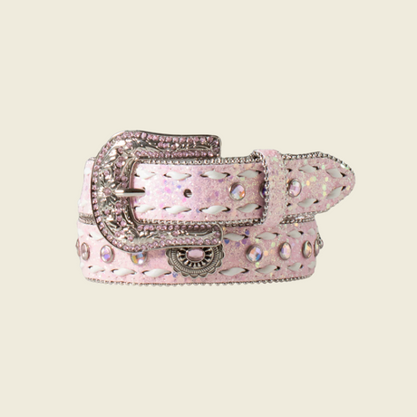 The Angel Ranch Girls Belt in Glitter Crystal Buck Lacing Pink features a Western-inspired design with sparkling rhinestones, a large ornate silver buckle, and an intricate stitched pattern, ideal for young cowgirls.