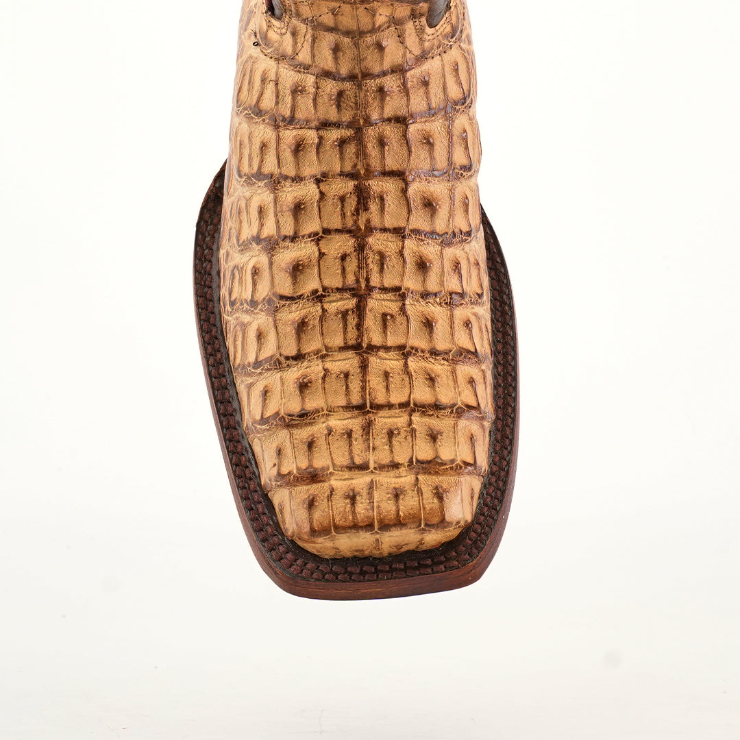 Close-up of an Exotic Caiman Hornback - Antique with a Rodeo Toe, showcasing authentic caiman leather with a crocodile texture and decorative stitching, on a plain white background.