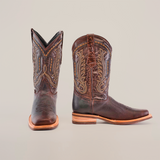 The Cheyenne Chocolate - Slip Resistant Sole Rodeo Toe boots made of premium cowhide feature intricate stitching on a white backdrop. One boot shows the side design, while the other reveals detailed toe stitching and sturdy wooden heels with a slip-resistant sole.