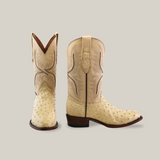 A pair of Exotic Full Quilt Ostrich - Bone cowboy boots with detailed stitching and intricate embroidery. One boot showcases the front, revealing skilled craftsmanship, while the other highlights the side and heel features.