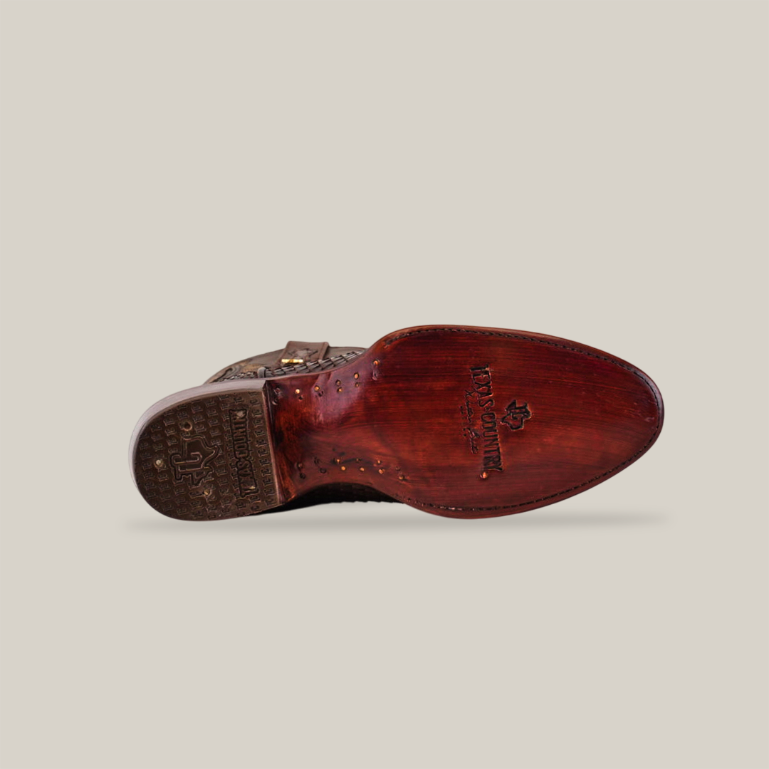 The image displays the bottom view of a single Exotic Python - Brown - Round Toe dress shoe with a polished leather sole, featuring decorative details on a light beige background that echo genuine python skin craftsmanship.