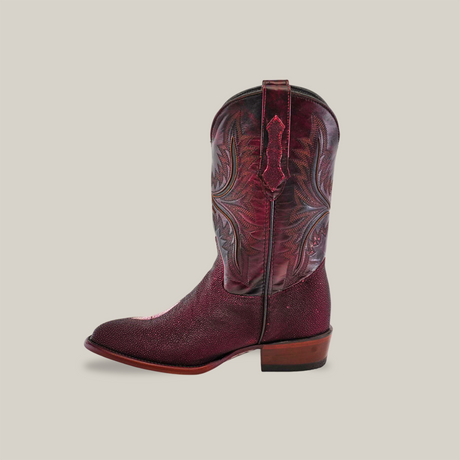 A single Exotic Stingray - Wine cowboy boot with detailed embroidery on the shaft, made from stingray leather, features a brown stacked heel and square toe against a plain beige background.