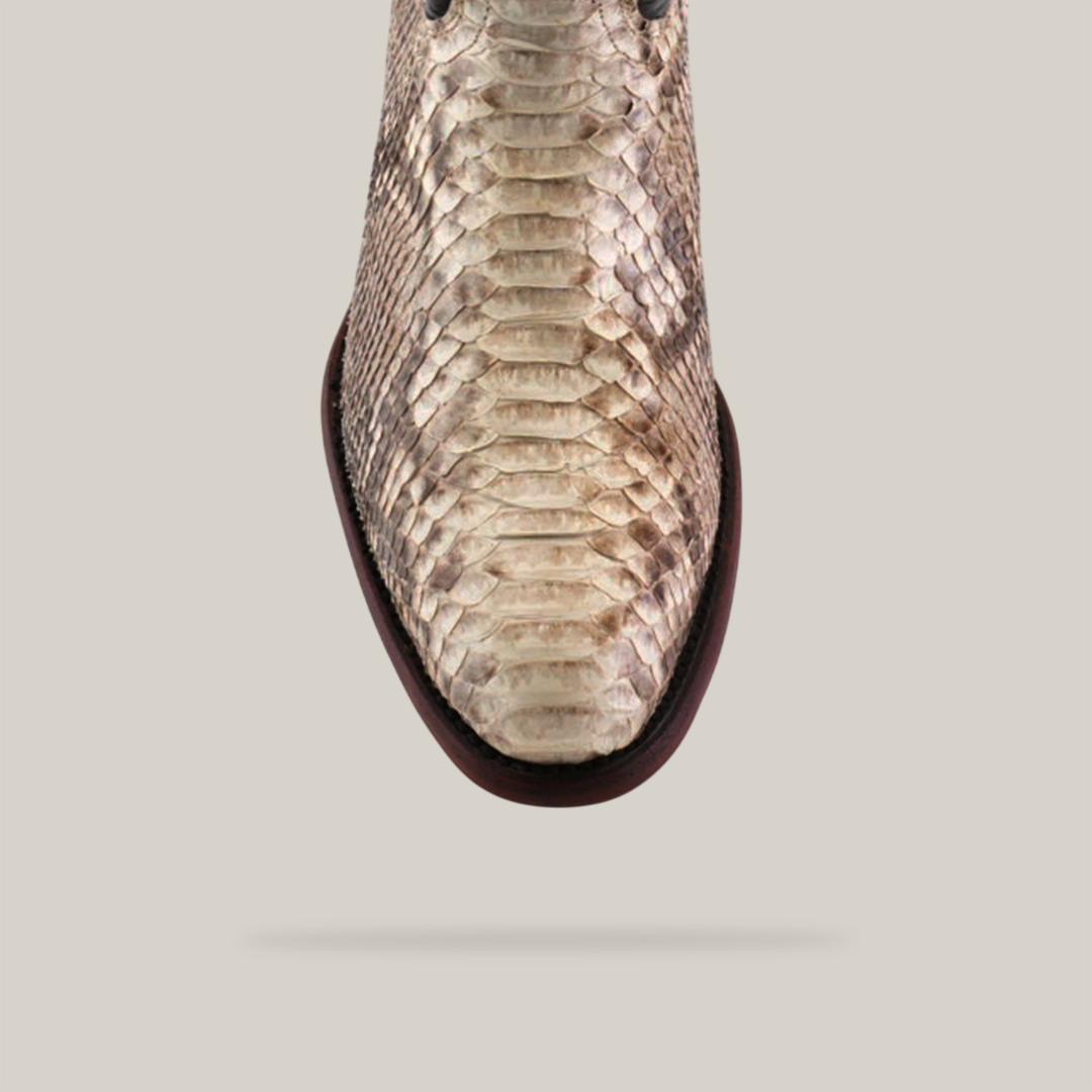 The Exotic Python - Natural boot, seen from above on a plain light background, showcases a brown and beige textured snakeskin pattern. This handcrafted boot emphasizes genuine python skin with its round toe and dark sole.