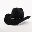 The 6X Leandro Black cowboy hat, crafted from premium sheeps wool, boasts a curved brim and a decorative band with silver conchos and star accents on a plain white background for a luxurious feel.