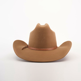 The 6X Leandro Fawn is a premium felt cowboy hat made from fine sheeps wool, showcasing a slightly curved brim with a decorative band at the crowns base, all on a plain white background.