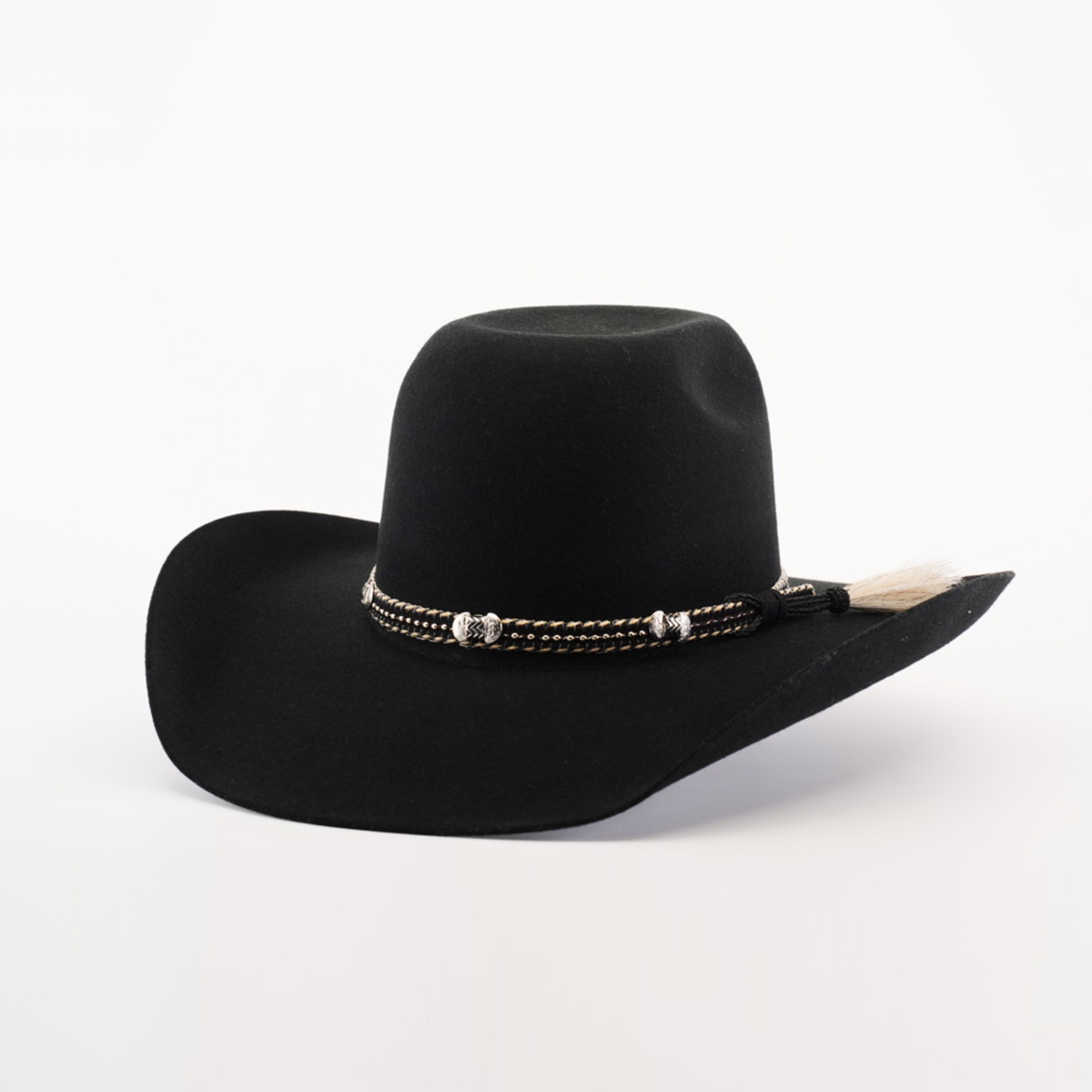 The 6X Brazil Black cowboy hat boasts a wide brim and is crafted from Brazil felt. It features a decorative braided band with silver accents and a small feather, capturing Western heritage against a plain white background.