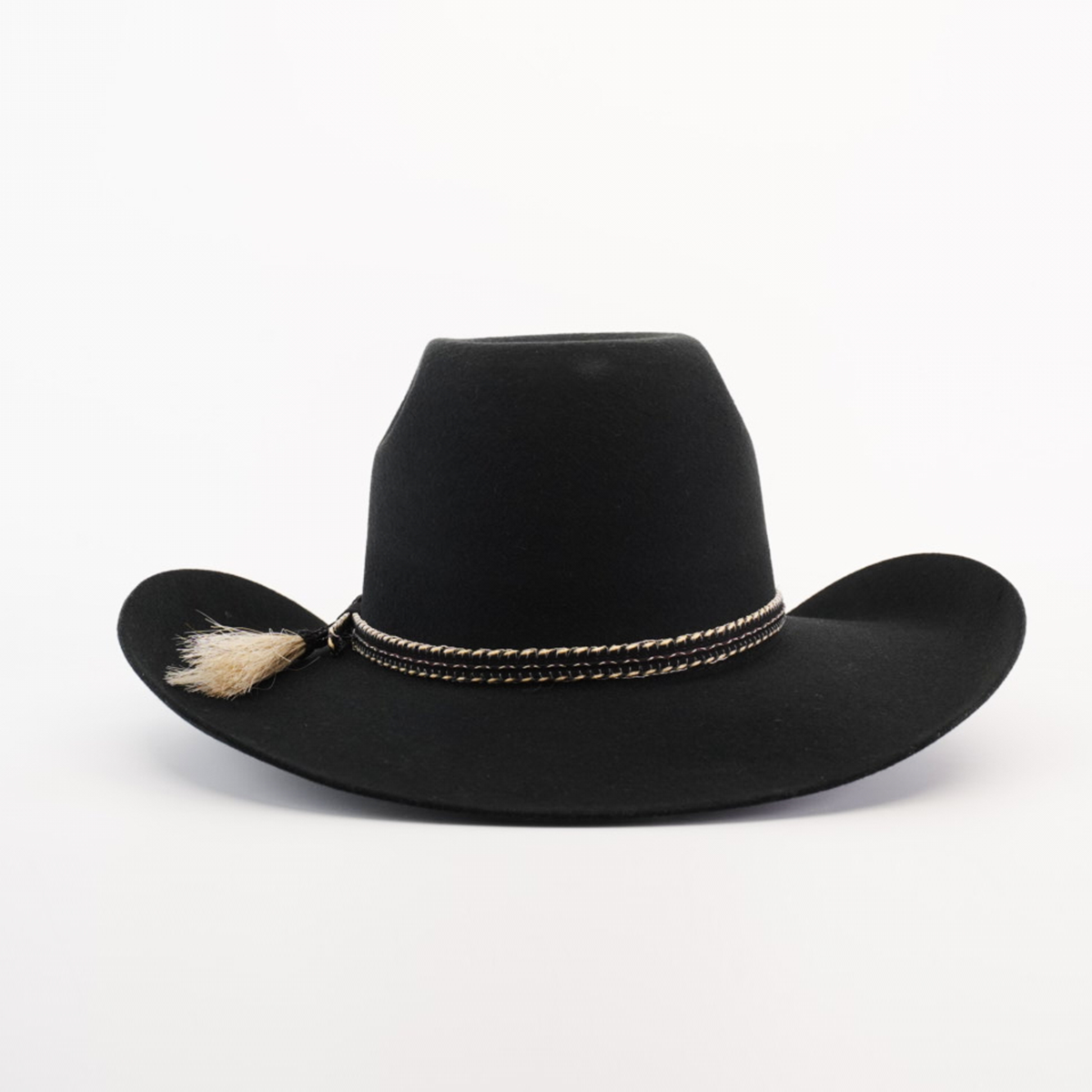 The 6X Brazil Black cowboy hat features a wide brim, crafted from Brazilian felt sheep wool, and is accented with a braided band and tassel, capturing Western heritage against a plain white background.