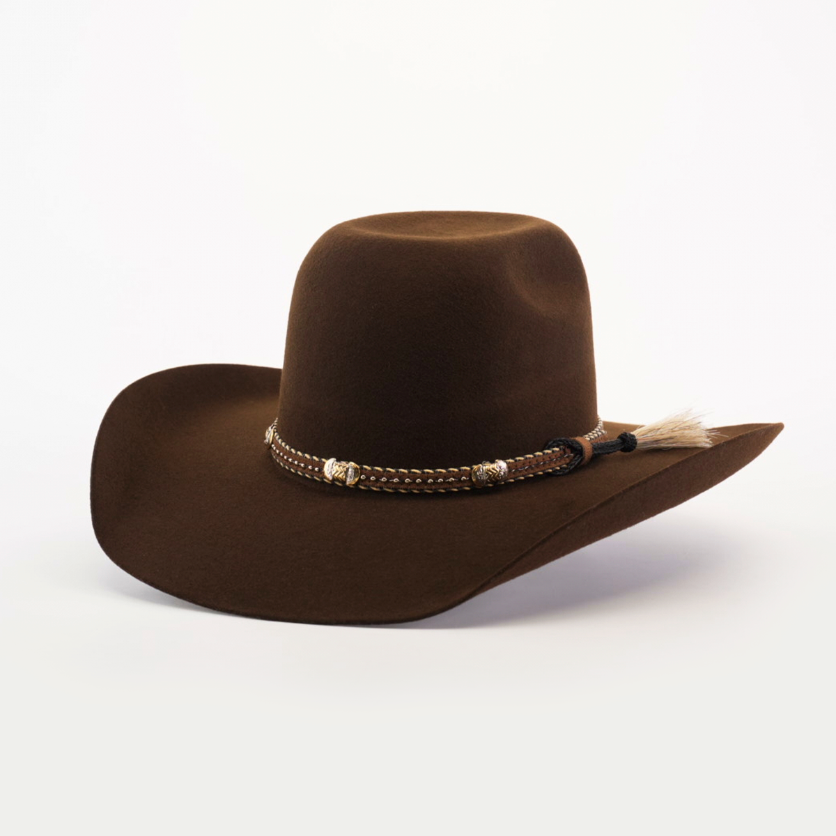 The 6X Brazil Brown is a felt hat with a Western flair, featuring a wide brim and a decorative band with beads and tassel, set against a plain white background.