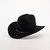 The X 2 Carnales Black is a black felt cowboy hat with a wide brim crafted from sheep wool. It features a decorative band with small metallic accents against a plain white background.