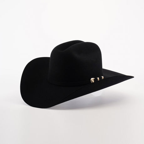 The 100X Tony Lama Black cowboy hat, made from premium beaver fur, exudes Western elegance with its wide brim and a decorative band featuring silver accents, all set against a plain white background.