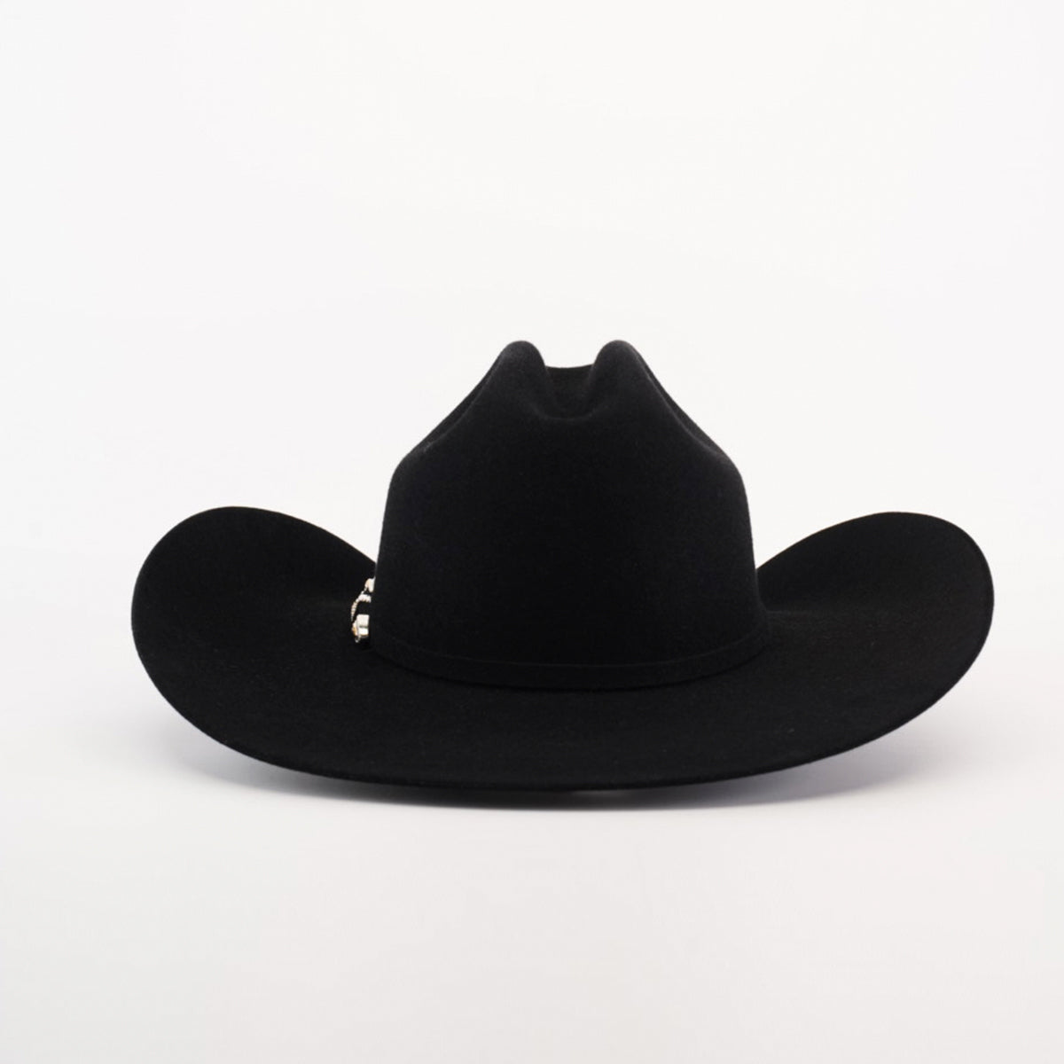 The 100X Tony Lama Black cowboy hat, made from premium beaver fur, showcases a wide brim and tall creased crown against a plain white background. A decorative silver band at the base embodies genuine Western elegance.