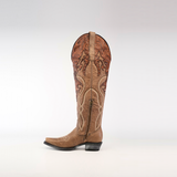 The Miriam Cappuccino - Tall Shaft - Snip Toe boot is a brown cowboy masterpiece with intricate floral embroidery and stitching. Featuring a side zipper, pointed toe, and black heel, its elegantly set against a white background.