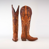 The Miriam Brick - Tall Shaft - Snip Toe cowboy boots, made of premium brown leather, feature intricate embroidery, detailed stitching, and a side zipper. One boot stands upright while the other is angled on a white background—perfect for womens style and comfort.