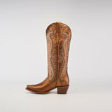 The Nihan Copper, a single brown cowboy boot with intricate stitching, showcases traditional craftsmanship. It features a snip toe, medium-height heel, and tall shaft against a plain light gray background, representing the finest in handcrafted excellence.