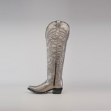 The Taylor Mercury - Tall Shaft - Snip Toe boot, a single silver cowboy boot, stands upright against a plain background. Designed by Taylor Mercury, it has intricate patterns, a low heel, and a durable leather sole.