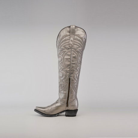 The Taylor Mercury - Tall Shaft - Snip Toe boot, a single silver cowboy boot, stands upright against a plain background. Designed by Taylor Mercury, it has intricate patterns, a low heel, and a durable leather sole.