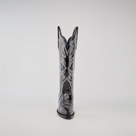 A single Artemisa Patent Black cowboy boot is displayed against a plain background, highlighting its shiny leather, intricate white stitching, tall shaft, and snip toe design.