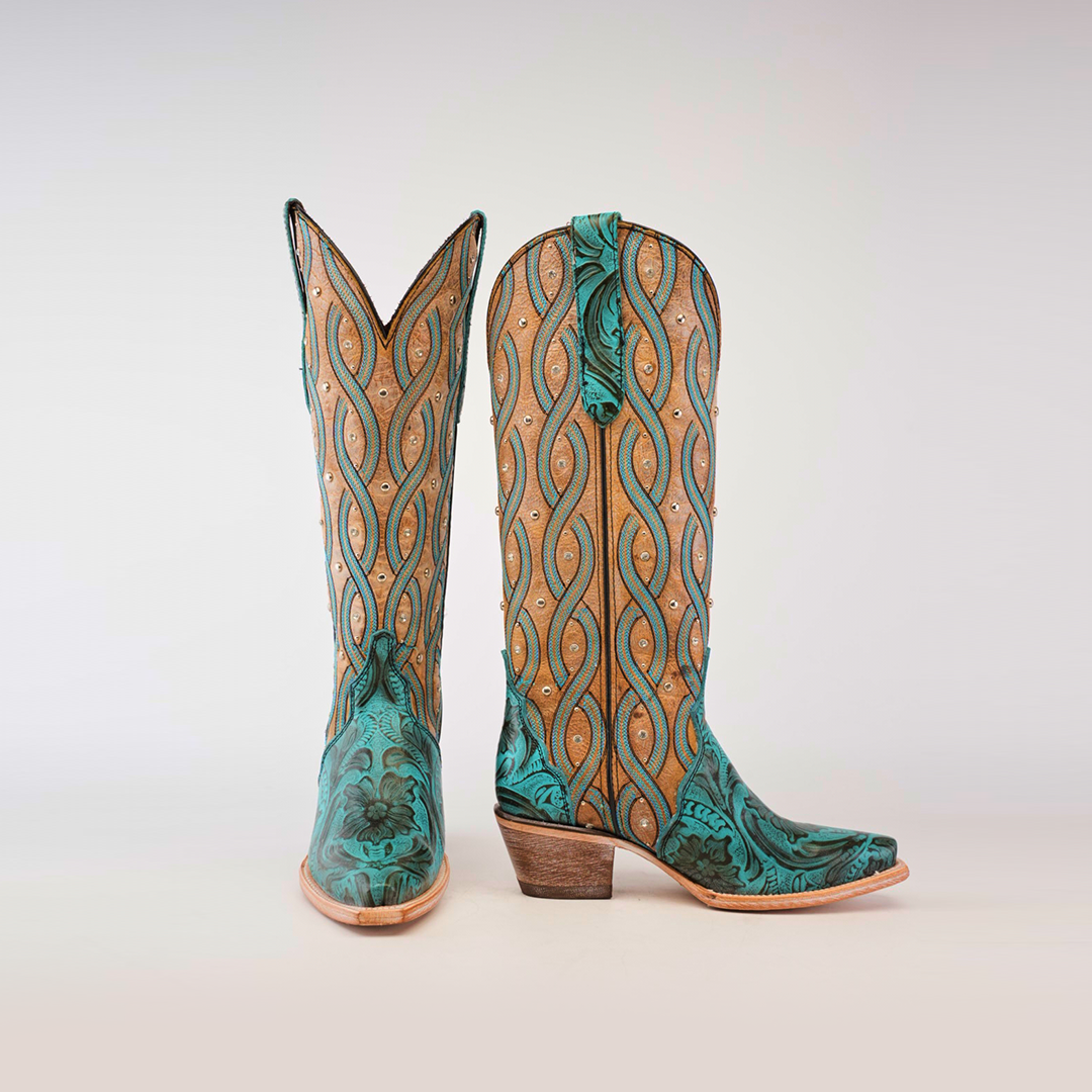 The Premier Turquoise Handtooled Flowers boots combine turquoise and tan leather with a wavy pattern and hand-tooled floral details, featuring a wooden heel and pointed snip toes against a plain white background.