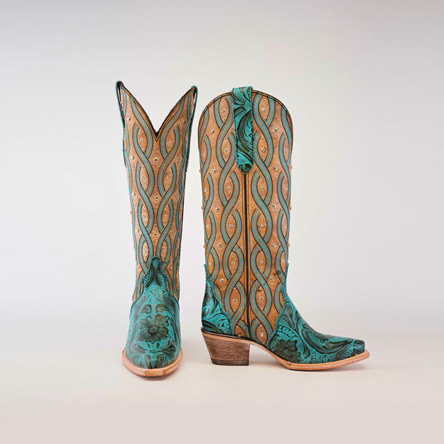 The Premier Turquoise Handtooled Flowers boots combine turquoise and tan leather with a wavy pattern and hand-tooled floral details, featuring a wooden heel and pointed snip toes against a plain white background.