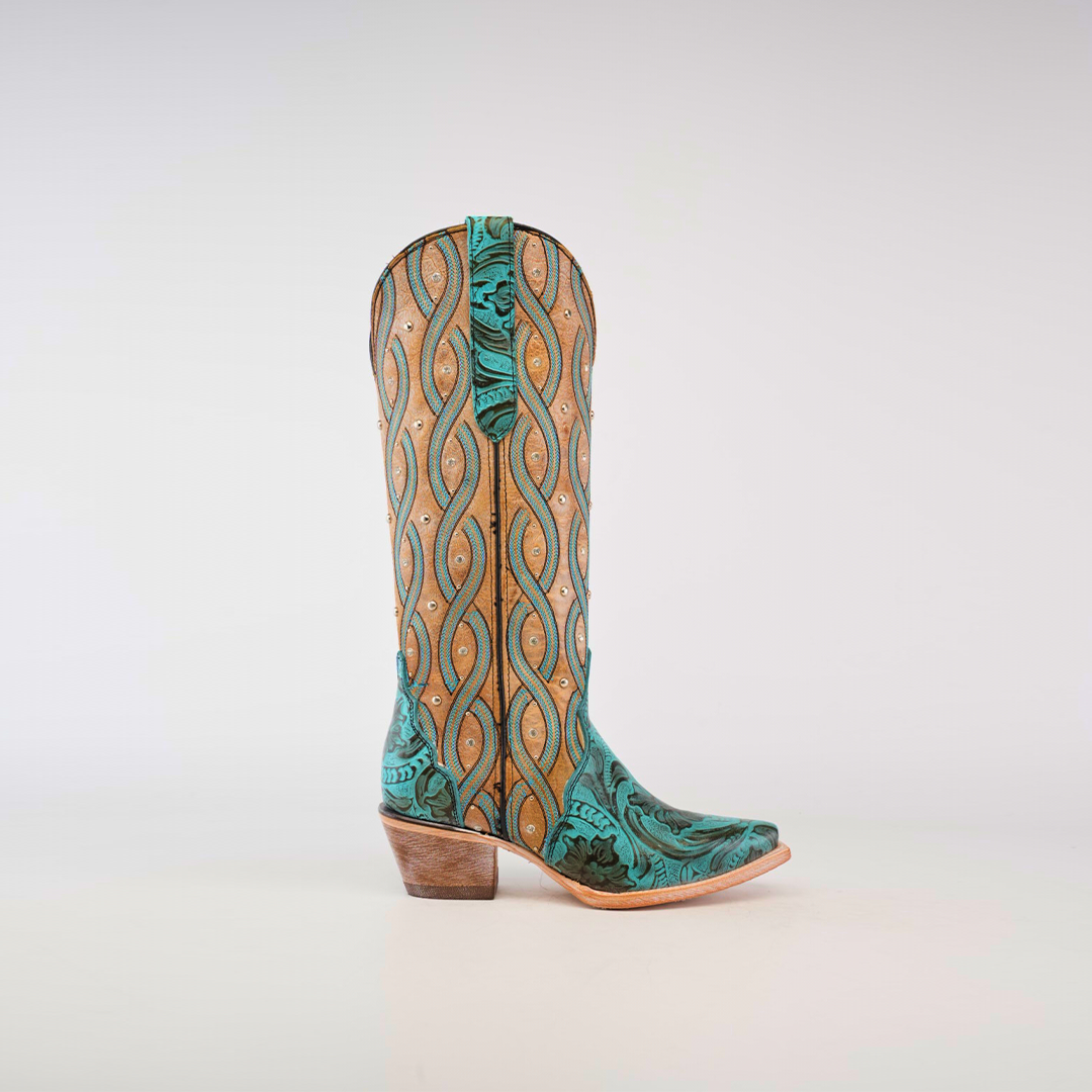 The Premier Turquoise Handtooled Flowers boot features a tall shaft and snip toe with a green and tan pattern, swirling designs, turquoise hand-tooled flowers, and decorative studs on premium-quality leather.