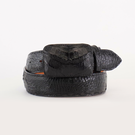 The Exotic Full Quilt Caiman - Black Belt features a black leather design with a crocodile skin texture, encompassing a rectangular belt loop and attached keeper, coiled neatly against a white background.