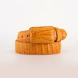 The Exotic Full Quilt Caiman - Bettercup Belt, in a coiled display against a white background, boasts a textured crocodile skin pattern in bright orange. It includes a matching orange buckle and is crafted from genuine leather.