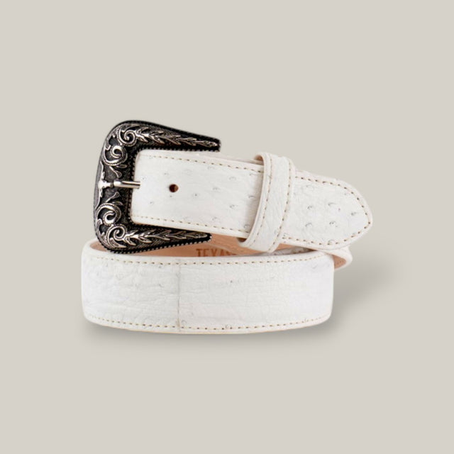 The Exotic Full Quilt Ostrich Texas Buckle White Belt is an elegant white leather belt crafted from luxurious ostrich leather, featuring a textured pattern and ornate silver buckle. This coiled belt against a neutral background exudes sophistication.