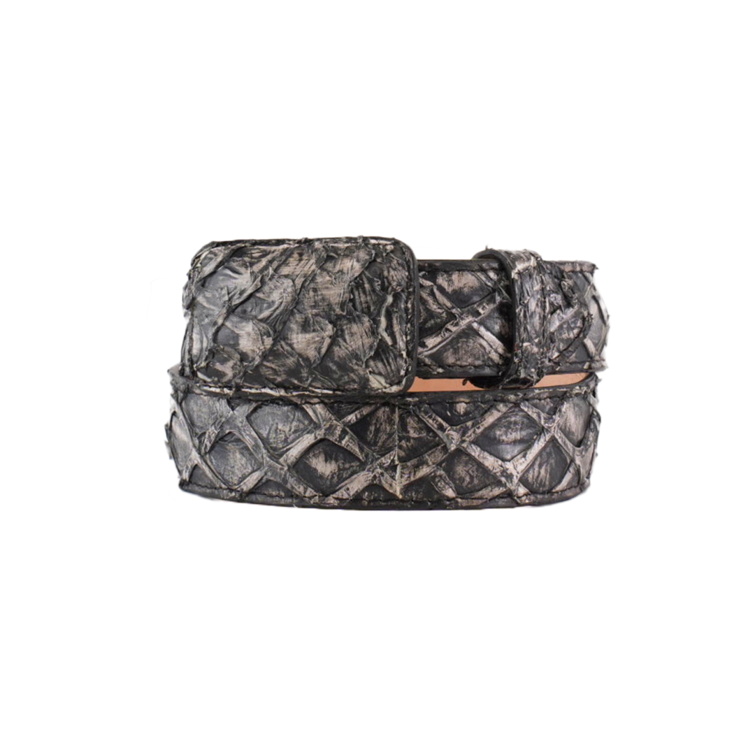 The Exotic Full Quilt Rustic Bone Belt is coiled in a circle, showcasing a diamond pattern with a rectangular buckle. Crafted from Pirarucu fish leather, it has an exotic allure with dark tones and shiny finish resembling metal or leather on a plain white background.