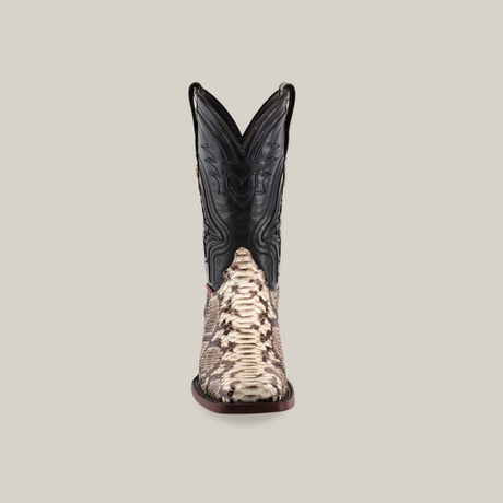 The Exotic Python - Natural - Rodeo Toe features a black leather upper with intricate patterns and a textured brown and beige Python design on the foot, showcased against a neutral background from the front.