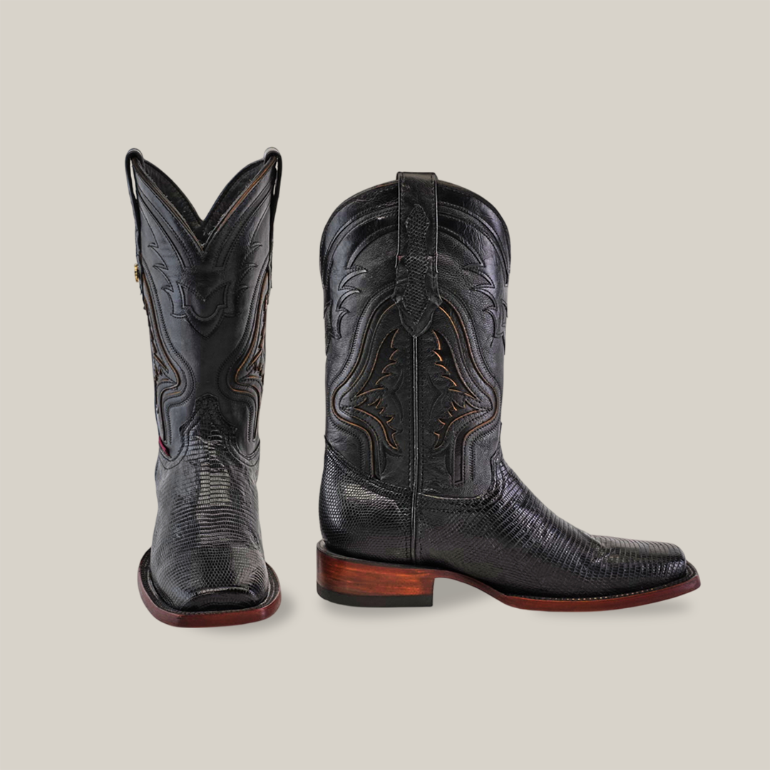 Displayed are the Exotic Lizard black cowboy boots with a rodeo toe design, one side and one front view. They feature a medium brown sole and heel that enhance their embossed patterns.