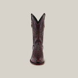 Front view of a single round-toe cowboy boot crafted from Exotic Caiman Hornback leather in rich black cherry, with intricate stitching and an embossed design, set against a light background.